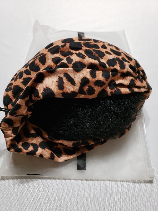 Photo 1 of WOMEN'S WIG AND CAP, UNKNOWN COLOR OR APPLICATION.
