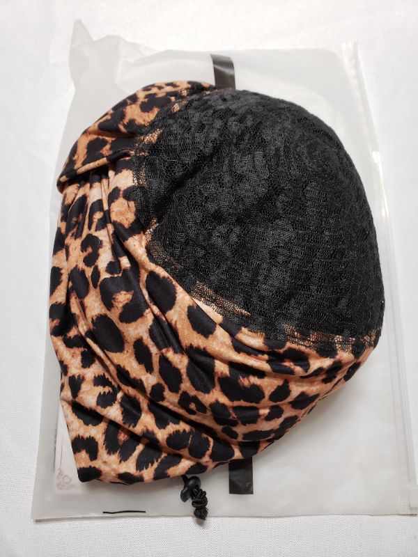 Photo 1 of WOMEN'S WIG AND CAP, UNKNOWN COLOR OR APPLICATION.