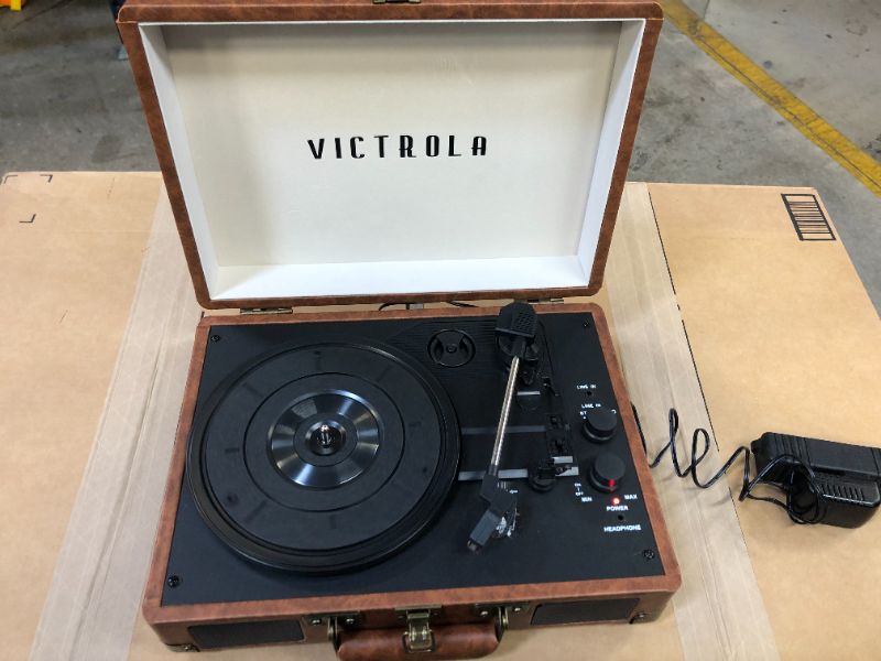 Photo 2 of Victrola Vintage 3-Speed Bluetooth Portable Suitcase Record Player with Built-in Speakers | Upgraded Turntable Audio Sound| Includes Extra Stylus | Brown (STICKER ON ITEM, MISSING BOX AND MANUAL)
