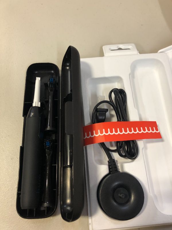 Photo 1 of hum by Colgate Black Electric Toothbrush for Adults, Starter Kit with Travel Case and Extra Refill Head, Rechargeable Smart Sonic Toothbrush, Black (USED BUT LOOKS NEW, MINOR DAMAGES TO BOX)
