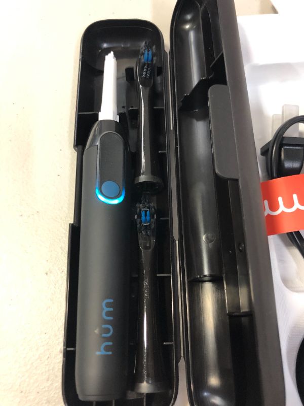 Photo 3 of hum by Colgate Black Electric Toothbrush for Adults, Starter Kit with Travel Case and Extra Refill Head, Rechargeable Smart Sonic Toothbrush, Black (USED BUT LOOKS NEW, MINOR DAMAGES TO BOX)
