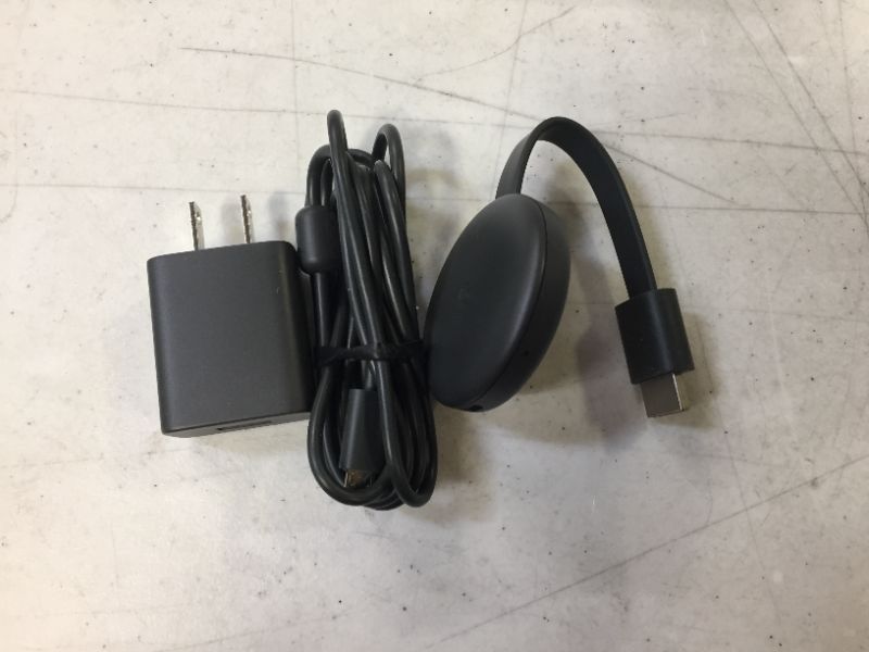 Photo 2 of Google Chromecast - Streaming Device with HDMI Cable - Stream Shows, Music, Photos, and Sports from Your Phone to Your TV
