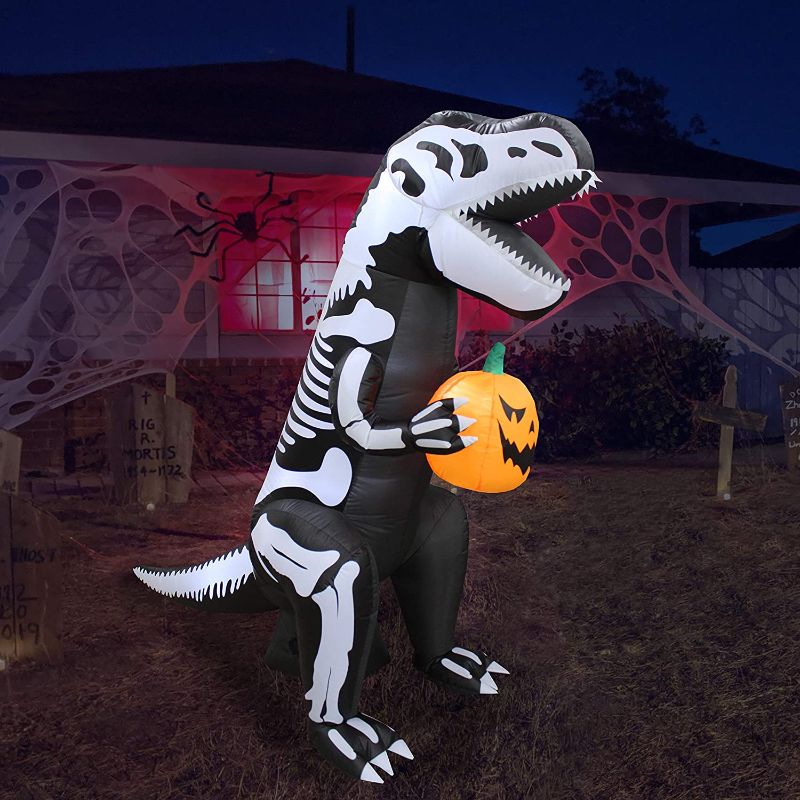 Photo 1 of 6 Foot Tall Halloween Inflatable Skeleton Dinosaur Tyrannosaurus T-Rex with Pumpkin Lights Lighted Blowup Party Decoration for Outdoor Indoor Home Garden Family Prop Yard
