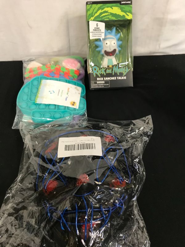 Photo 1 of  MISC PACK OF VARIOUS ITEMS, LIGHT UP MASK, SENSORY FIDGET TOYS, RICK AND MORTY FIGURE