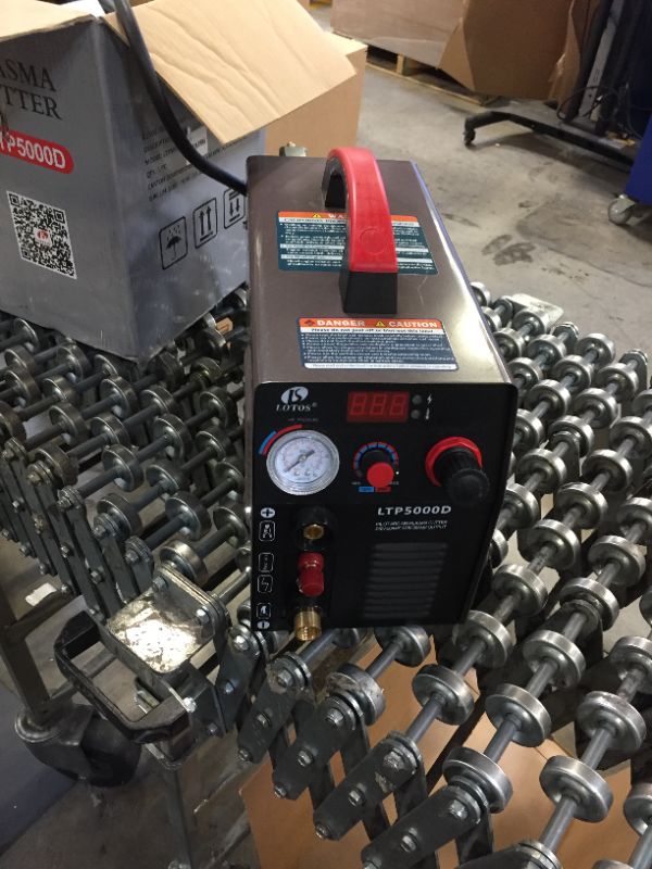 Photo 1 of LOTOS LTP5000D 50Amp Non-Touch Pilot Arc Plasma Cutter, Dual Voltage 110V/220V, 1/2 Inch Clean Cut, Brown
