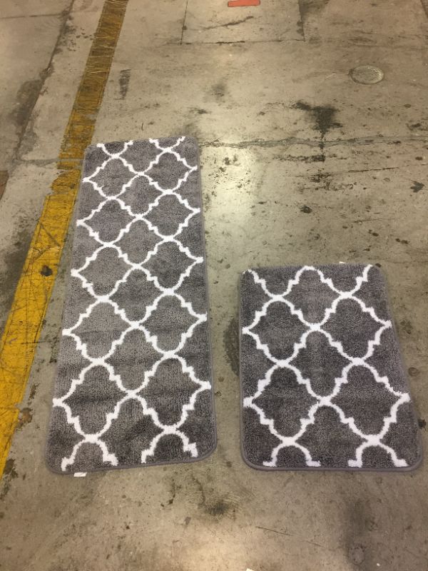 Photo 1 of 2 BATH RUGS GREY AND WHITE
1 LONG SIZE 4FT X 1FT 7INCH
1 SHORT SIZE 2FT X N1FT 5 INCH 