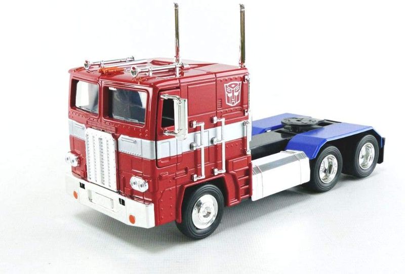 Photo 1 of Transformers G1 Optimus Prime Truck with Robot on Chassis Die-cast Car miniature
