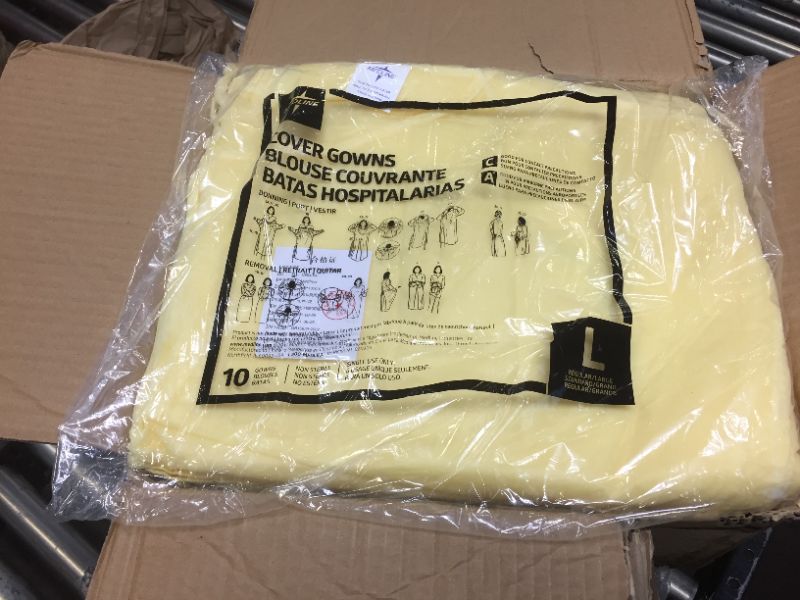 Photo 2 of Disposable Isolation Gown Size: Universal Qty: 50 per Case (Yellow)
