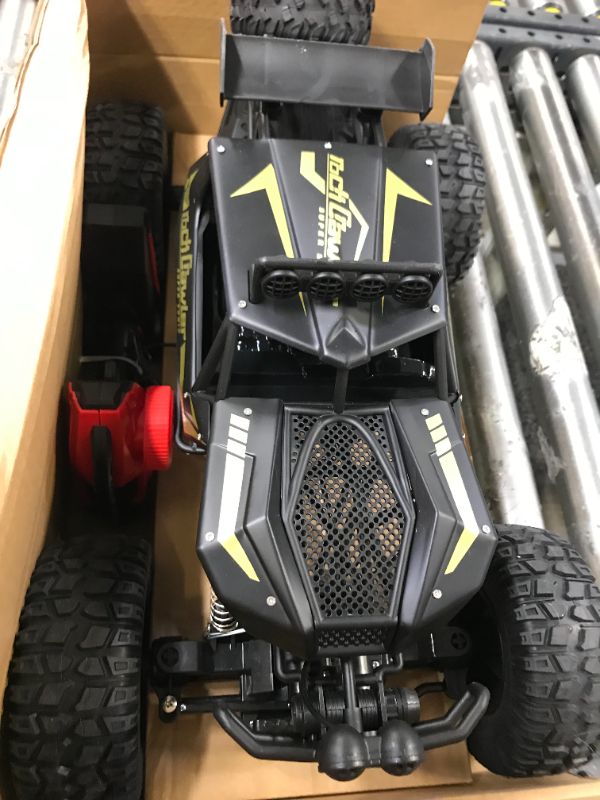 Photo 4 of Kids RC Car Toy, Remote Control Car 1:12 Big Scale 4WD Off Road Rock Crawlers 2.4Ghz Radio Remote Control Monster Trucks,High Speed Racing All Terrain Climbing Car Gift for Kids
