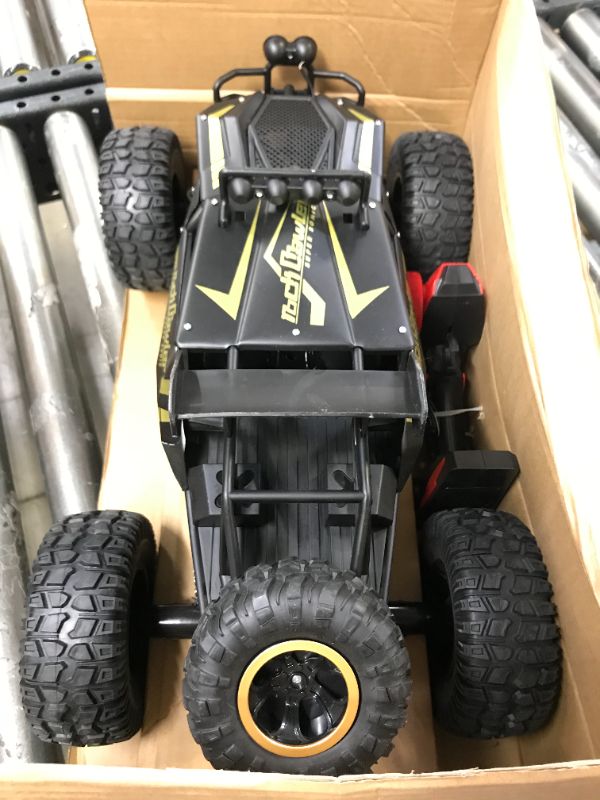 Photo 5 of Kids RC Car Toy, Remote Control Car 1:12 Big Scale 4WD Off Road Rock Crawlers 2.4Ghz Radio Remote Control Monster Trucks,High Speed Racing All Terrain Climbing Car Gift for Kids
