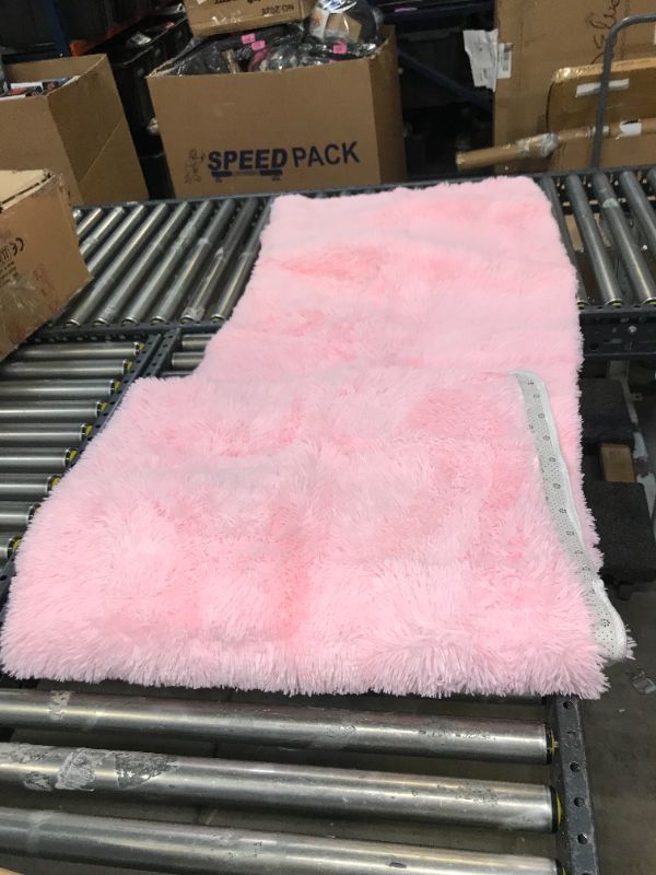 Photo 2 of 54inx90in pink shaggy rug -- like new in the box 