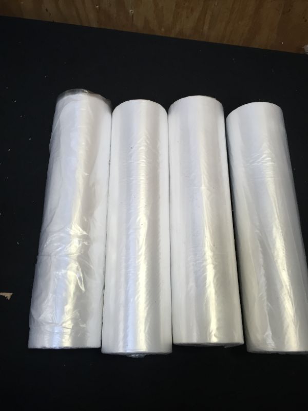 Photo 1 of  4 packs plastic roll bags (produce bags)