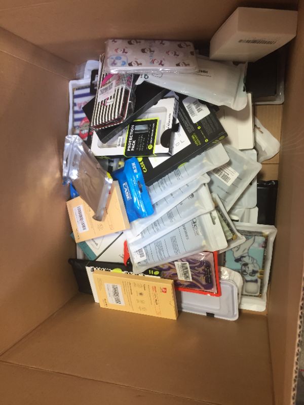 Photo 1 of Box of various phone cases and screen protectors for wide variety of phones