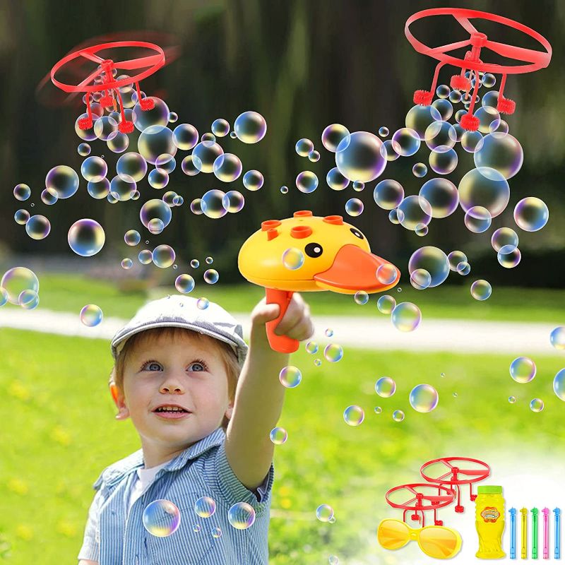 Photo 1 of Bubble Machine for Kids UFO Flying Disc Bubble Blower Toddler Outdoor Toys Duck Bubble Maker with Glasses & Bubble Stick Summer Outside Toys Lawn Backyard Yard Games for Boys Girls 
