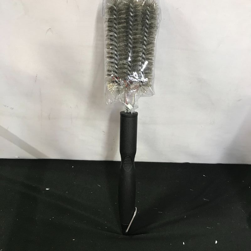 Photo 1 of large grill cleaning brush