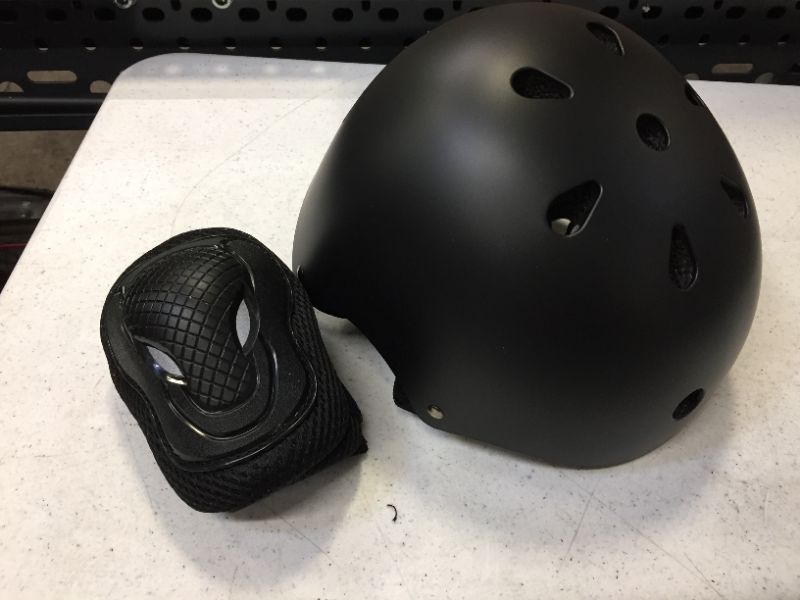 Photo 2 of children's black helmet and pads small size 