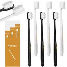 Photo 1 of 2 pack soft toothbrushes ( 4 black and 4 white in each pack ) 