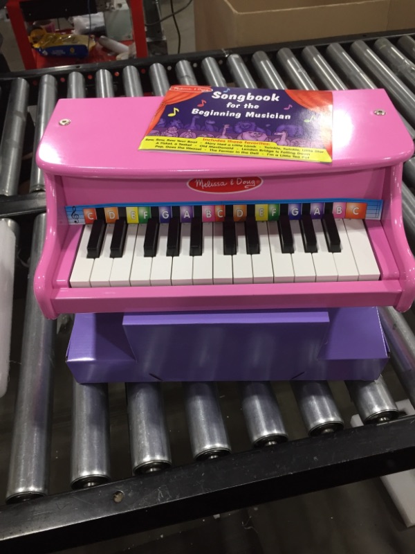 Photo 2 of Melissa & Doug Learn-to-Play Pink Piano With 25 Keys and Color-Coded Songbook