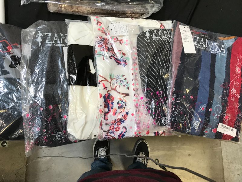Photo 1 of Clothing items: Left to right XL,2XL, 3XL, 4XL, last two are 5XL