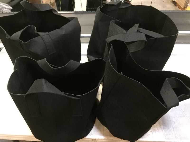 Photo 1 of 4 PC BLACK BAGS (ITEM IS DIRTY)