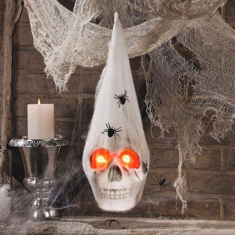 Photo 2 of 
Realistic Halloween Skeleton Skull with Glowing Eyes, Super Stretchy Spider Web for Halloween Party Favors and Halloween Props