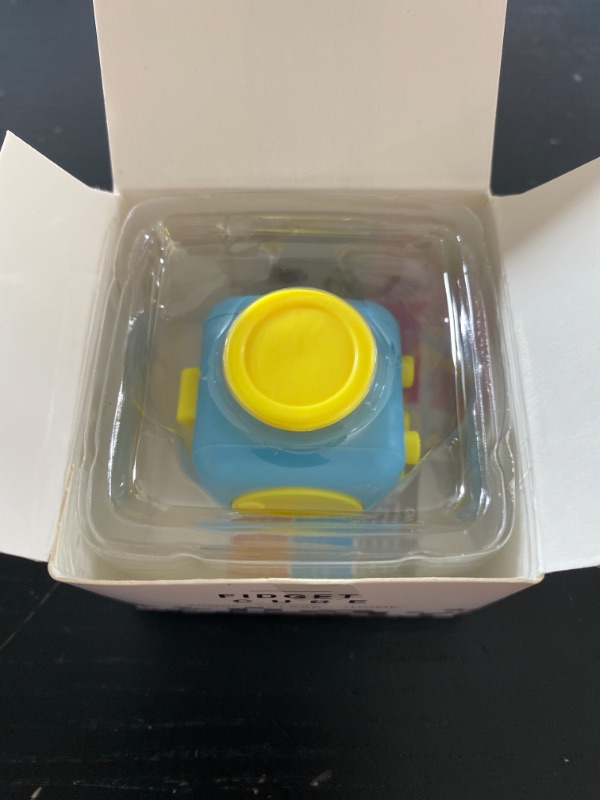 Photo 1 of fidget cube, blue and yellow