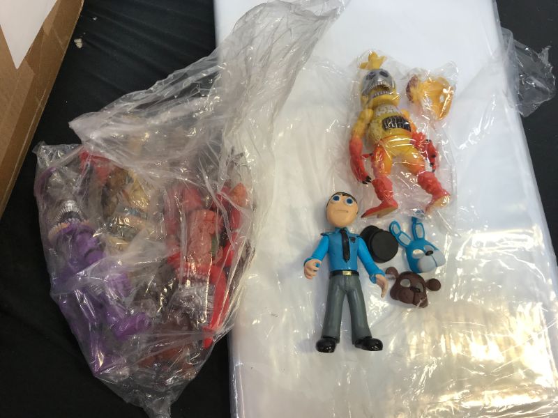 Photo 1 of BAG OF KIDS TOY FIGURES WITH MASKS (TOY FIGURES MAY VARY)