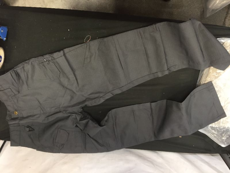 Photo 1 of 3 pack of women's cargo pants size medium 2 khaki and 1 grey