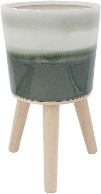 Photo 1 of Amazon Brand – Rivet Mid-Century Stoneware Planter with Wood Stand, 12.99"H, Green Ombre
