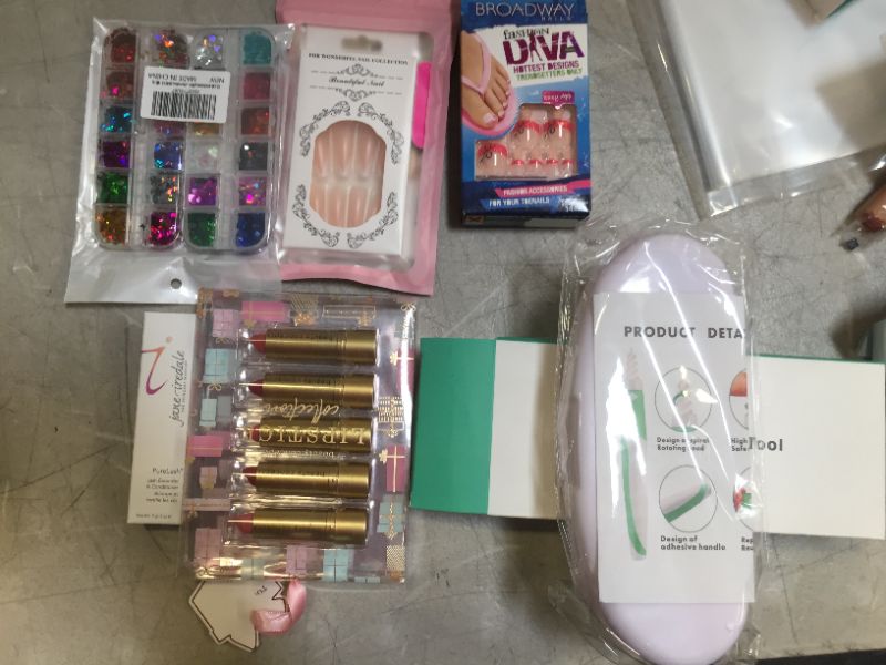 Photo 3 of Assorted Beauty Products (Lipstick, earwax remover, nails, eyelash extender) 