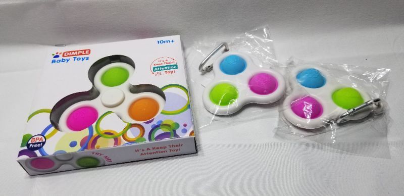 Photo 1 of ASSORTED DIMPLE FIDGET TOYS