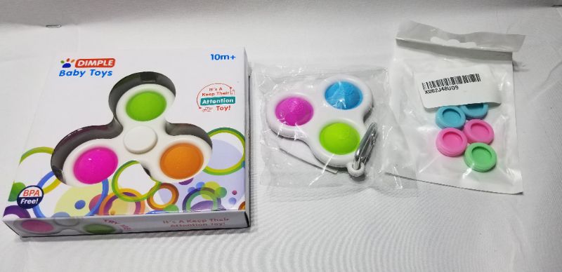 Photo 1 of ASSORTED DIMPLE FIDGET TOYS