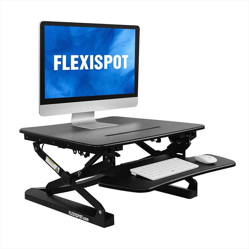 Photo 1 of FLEXISPOT M1B Stand Up Desk - 27" Wide Height-Adjustable Standing Desk Riser with Removable Wider Keyboard Tray
