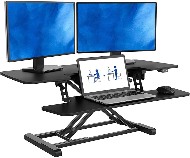 Photo 1 of FlexiSpot Motorized Standing Desk Converter- 40" Electric Height Adjustable Stand up Desk Riser with Quick Release Keyboard Tray EM7L
