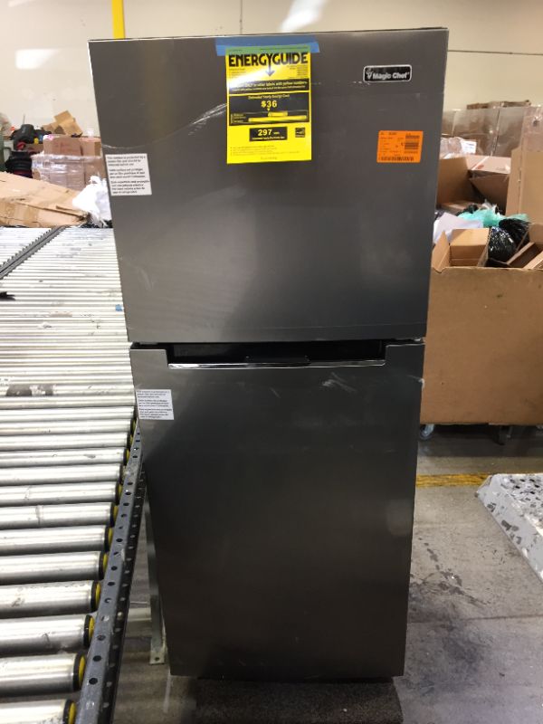 Photo 2 of 10.1 cu. ft. Top Freezer Refrigerator in Platinum Steel - MINOR DENTS - DIRTY 
