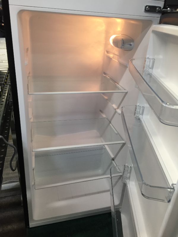 Photo 4 of 7.1 cu. ft. Top Freezer Refrigerator in Stainless Steel Look - MINOR DENTS/DIRTY 
