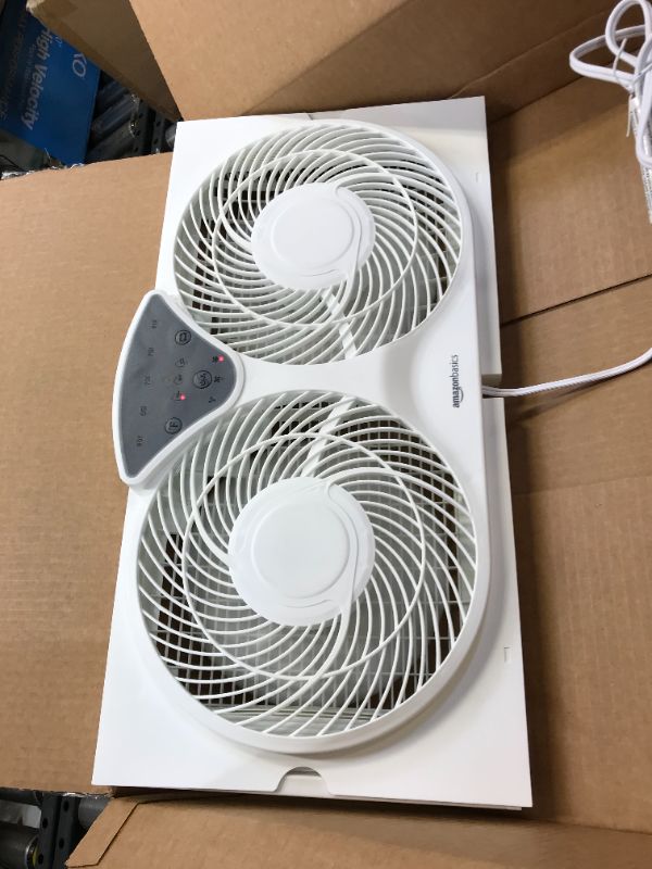 Photo 2 of Bionaire Window Fan with Twin 8.5-Inch Reversible Airflow Blades and Remote Control, White
