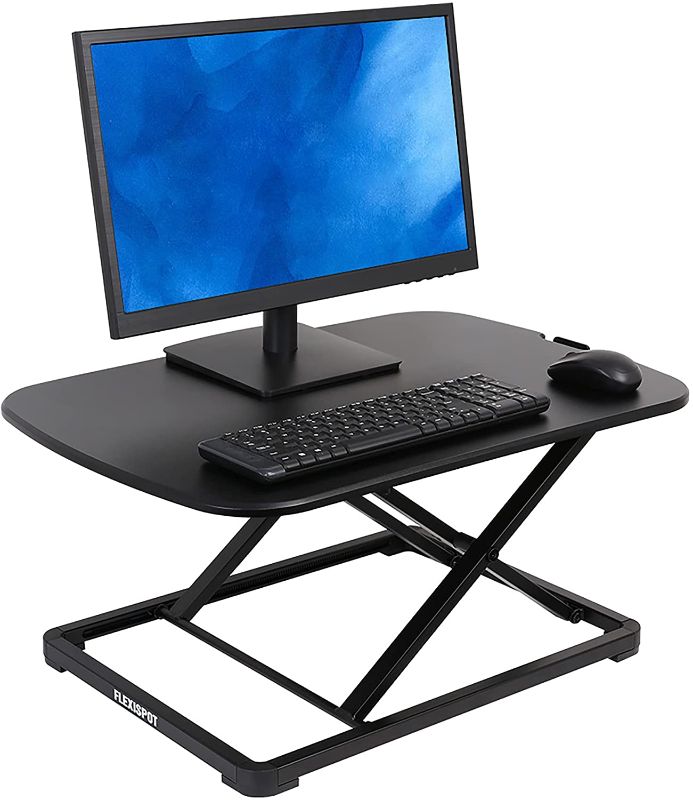 Photo 1 of FlexiSpot Laptop Desk Riser - 27" Standing Desk Sturdy Sit Stand up Converter for Laptop Notebook ( ML2B Black Laptop Stand, No Assembly Required)
