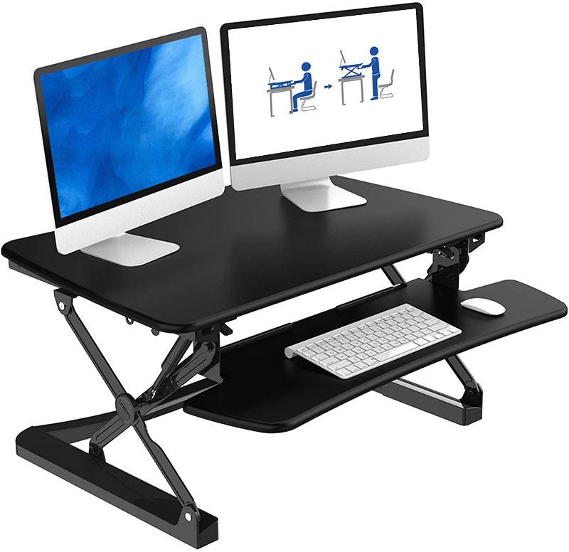 Photo 1 of FlexiSpot Standing Desk - 35 wide platform Height Adjustable Stand up Desk Computer Riser with Removable Keyboard Tray (Med