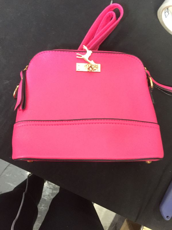 Photo 1 of bright pink crossbody purse