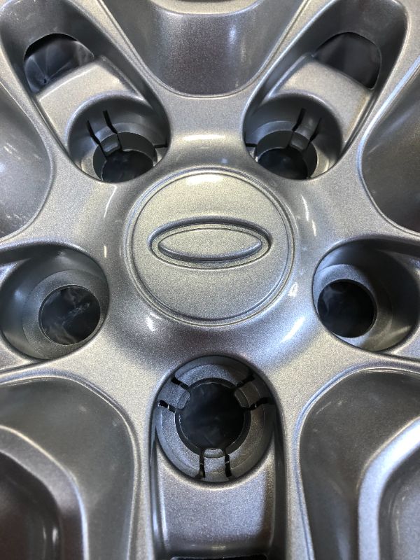 Photo 2 of set of 4 hub caps 
