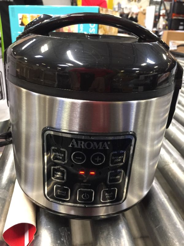 Photo 2 of Aroma Digital Rice Cooker and Food Steamer, Silver, 8 Cup
**HAS A DENT ON THE BACK**