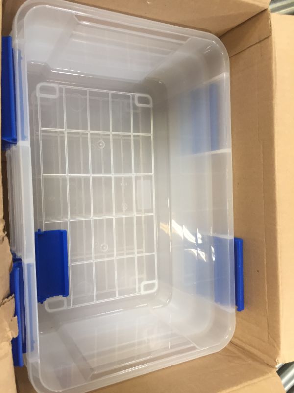 Photo 1 of 3 plastic containers with lids --one of the lids is damaged 