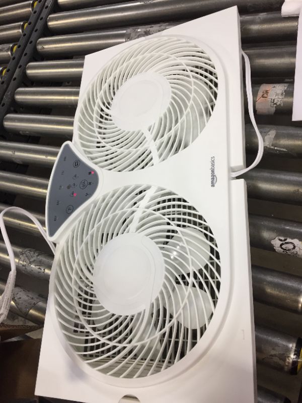 Photo 1 of Amazon Basics Digital Window Fan with Twin 9-Inch Reversible Airflow Blades and Remote Control