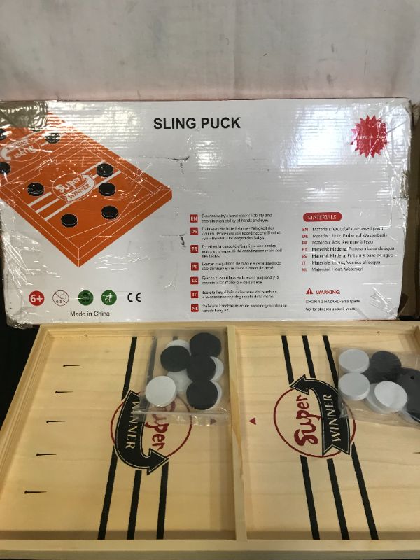 Photo 2 of  Fast Sling Puck Game with Extra 10 Pucks & 2 Slingshots for Spare Use, Portable Slingpuck Board Game for Child, Foosball Slingshot