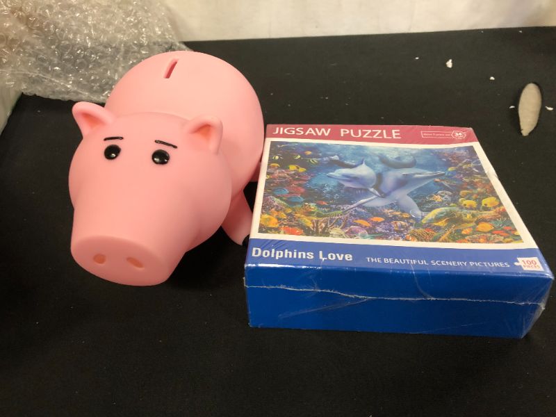 Photo 2 of 100 piece dolphin jigsaw puzzle, and one piggy bank