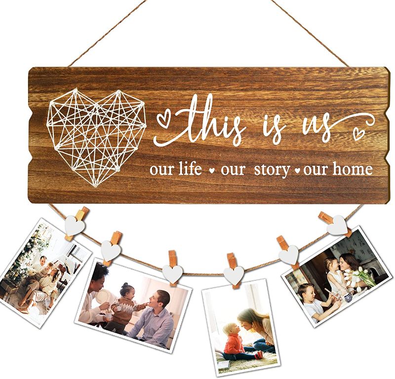 Photo 1 of Buecasa Housewarming Gifts New Home Sign Decor - Rustic Wall Hanging Picture Frame with 6 Heart Clips -This is Us Wall Decor 15.8x6.0 Inches
