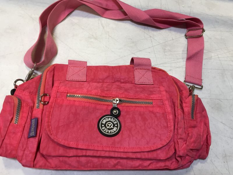 Photo 2 of JINQIAOER Nylon Handbag Outdoor Travel Shoulder Bag Crossbody Bag
---key chain not included--