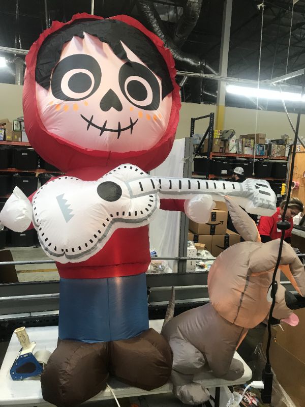Photo 1 of Gemmy 6.5 ft. Coco Miguel with Guitar and Dante Scene Airblown Disney Halloween