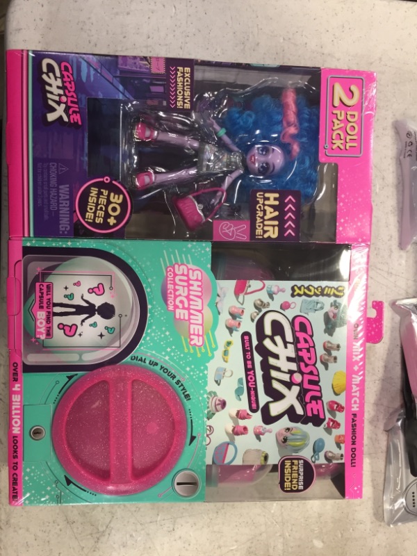 Photo 1 of CAPSULE CHIX SHIMMER SURGE DOLL 2 PACK, 4.5IN BLUE SMALL DOLL W/ CAPSULE MACHINE
